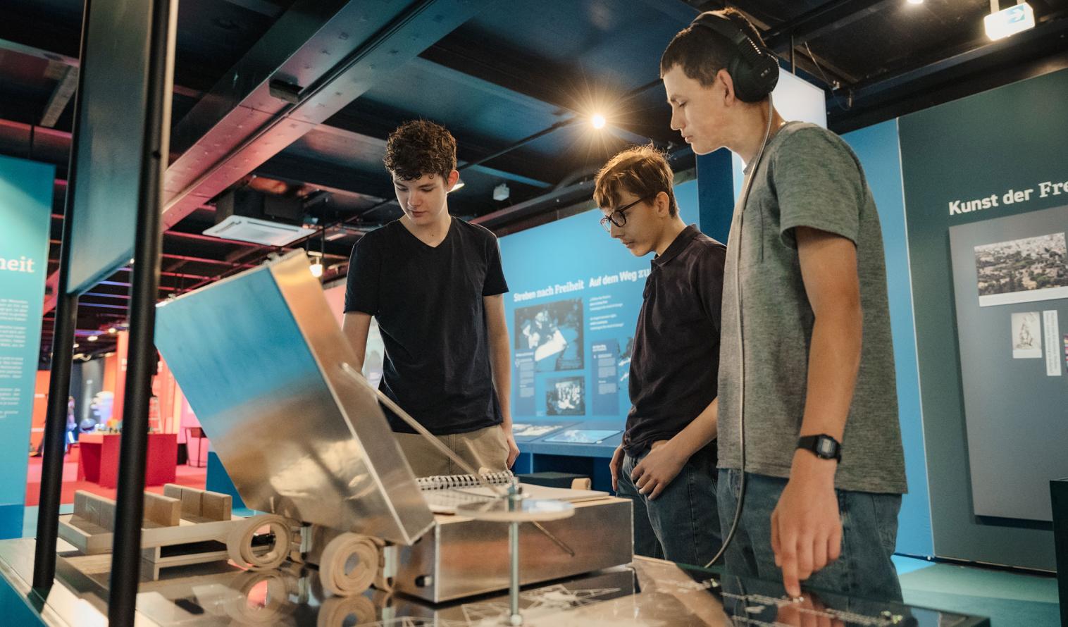 Young people explore an exhibit on the MS Wissenschaft